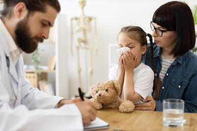 Child's-Doctor-Writng-Prescription-for-Child-with-Flu
