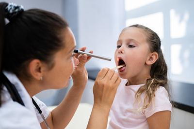 Child's-Doctor-Examines-Child's-Throat