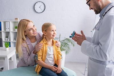 Mother-and-Little-Girl-with-Asthma-Visits-Children's-Doctor's-Clinic