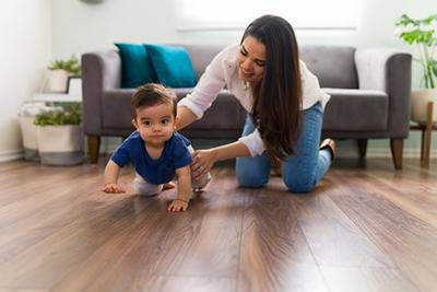 Little boy trying to crawl with her mother
