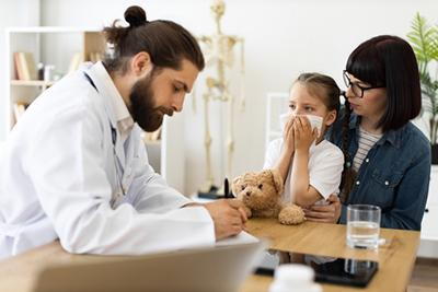 Young child visiting the doctor due to illness