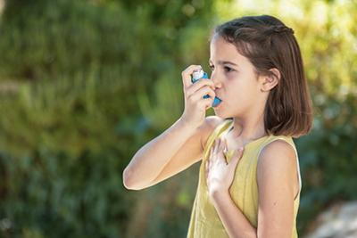 Child-With-Asthma-Uses-Inhaler-Outside