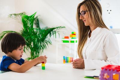 Developmental checkup for child using educational puzzle toys