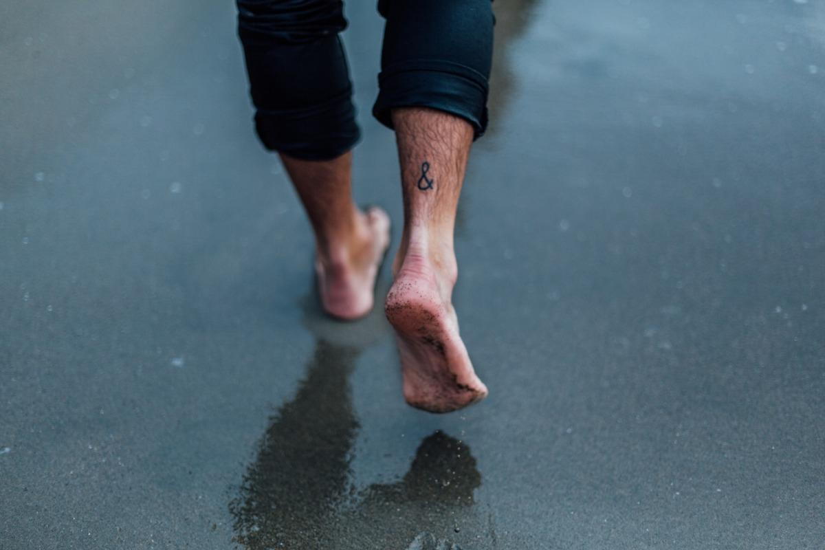 Man walking barefoot
