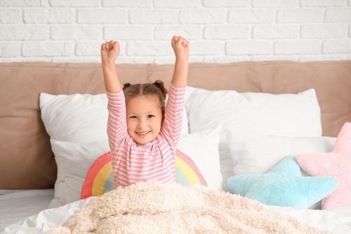 Child waking up refreshed and cheerful