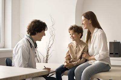 Mom supporting her child during pediatric wellness visit