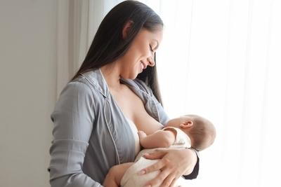 Mother giving a breastfeed for her baby.