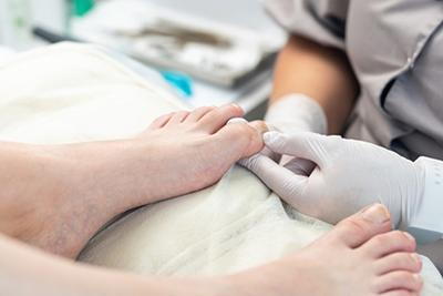 Foot-Doctor-Checking-Patient's-Ingrown-Toenail