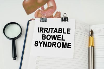 Clipboard showing printed text about irritable bowel syndrome