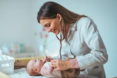 Newborn checking by the caring doctor on clinic.