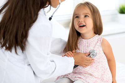 Doctor-check-the-heartbeat-of-a-young-girl-in-clinic.