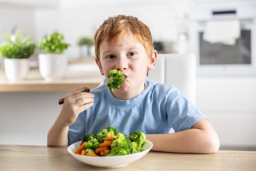 Child enjoying nutritious food to support healthy growth and development