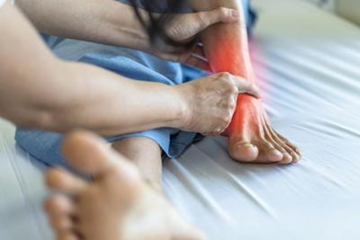 Podiatrist-Examines-Senior-Patient's-Feet-with-Arthritis
