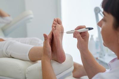 Diabetic patient’s foot being checked for nerve damage