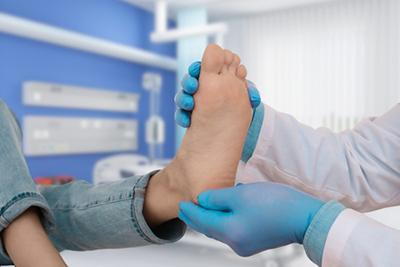 Foot-Doctor-Checking-Patient's-Diabetic-Feet