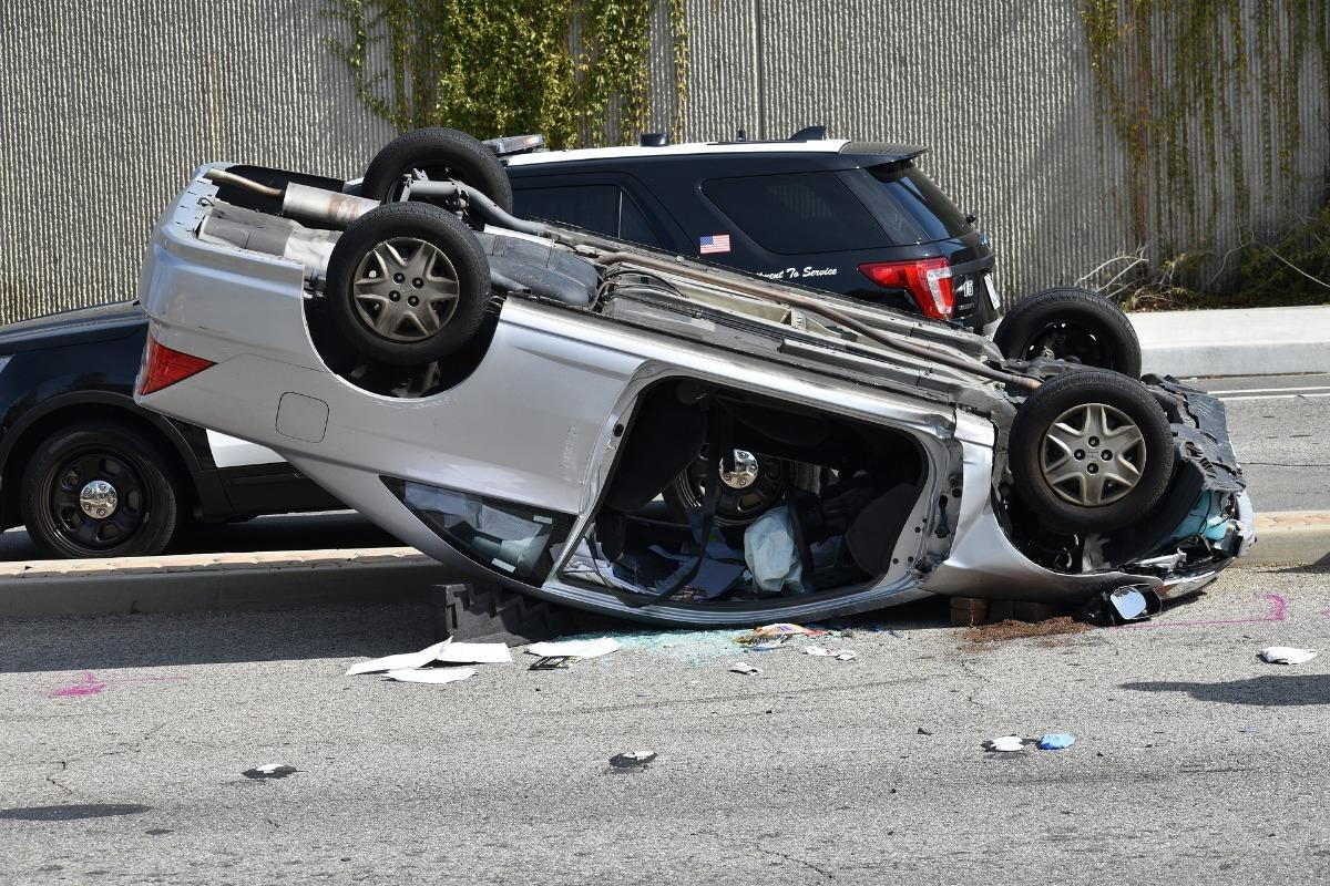 An overturned white car