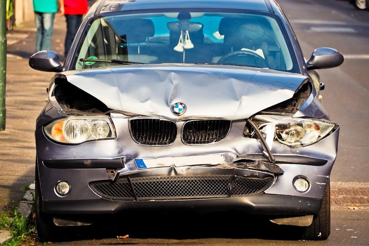 A BMW sedan with front-end damage