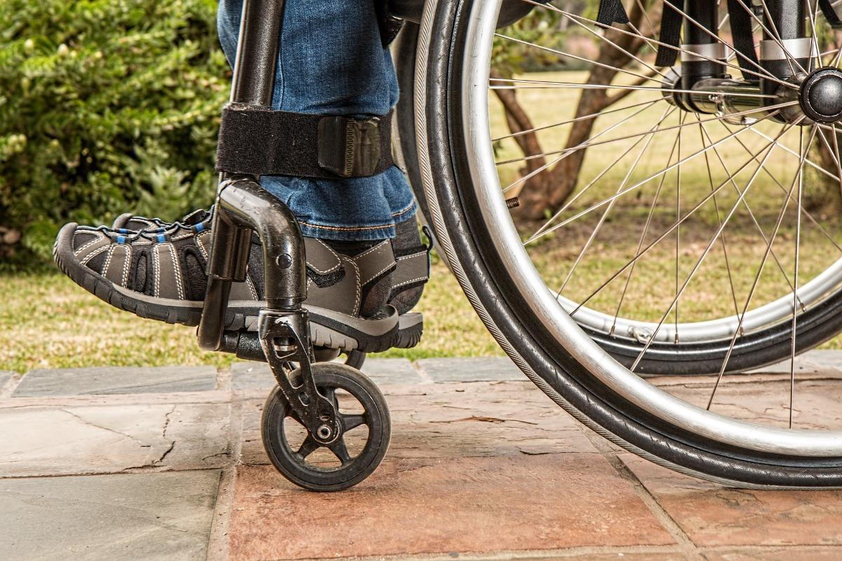 A person's feet in a wheelchair