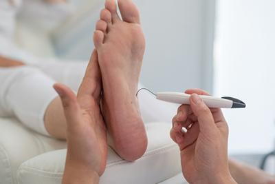 Podiatrist-Assessing-Nerve-Sensitivity-in-a-Diabetic-Patient’s-Foot