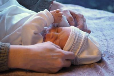 Mother taking care of a new born baby