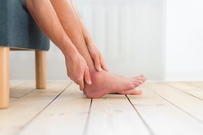 Male patient with swollen ankle from sprain