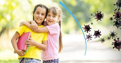 Smiling kids with a protective shield symbolizing immunity from viruses