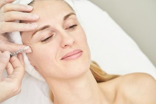 Cosmetic Dysport treatment for crow's feet on female client