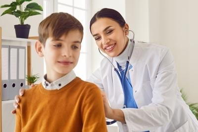 Young boy check by the doctor on clinic