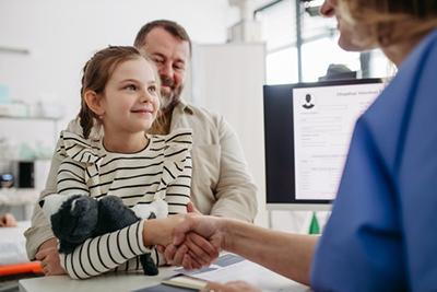 Smiling-Kid-Shaking-Hands-With-Doctor