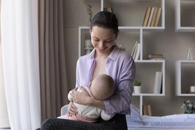 Mother-breastfeeding-baby-with-lactation-guidance.
