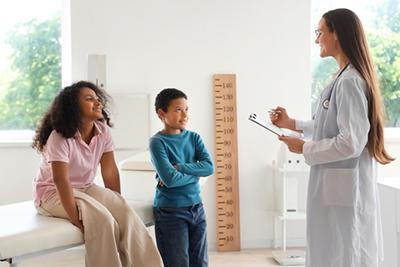 Two-Children-Visits-Pediatrician-for-Nutrition-Tips