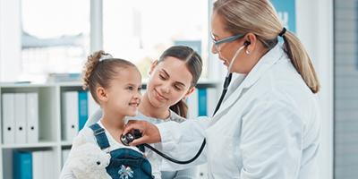 Child and parent at pediatric clinic for regular health check