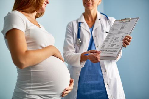 Pediatrician during prenatal counseling with pregnant woman