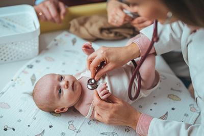 Pediatrician-Listening-to-a-Newborn’s-Heartbeat-with-a-Stethoscope