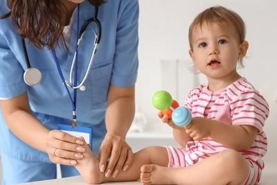 Doctor checking the healthy todler.