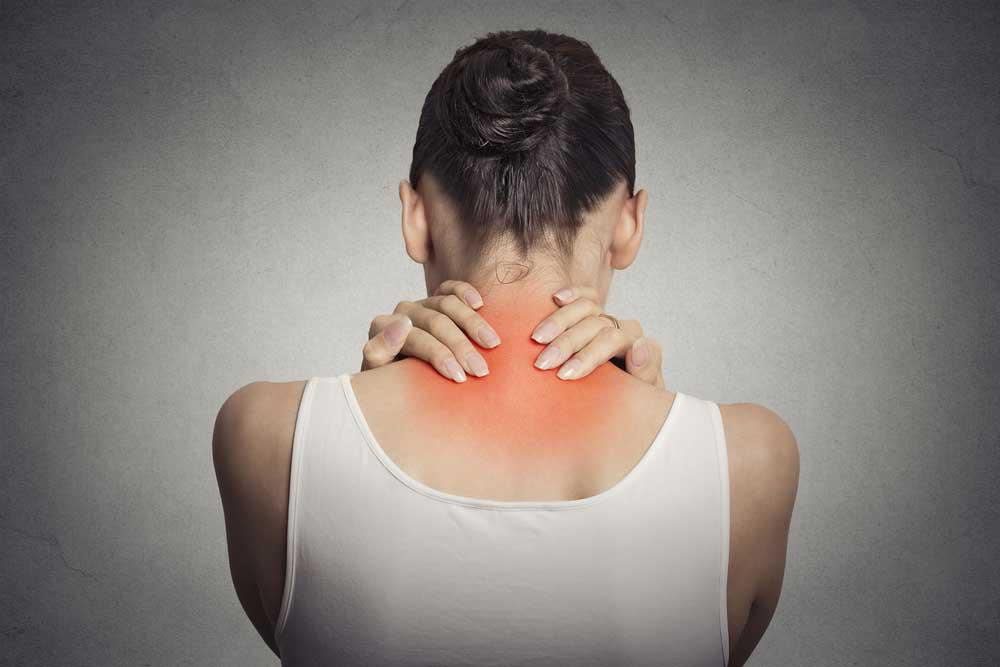 woman enduring neck pain