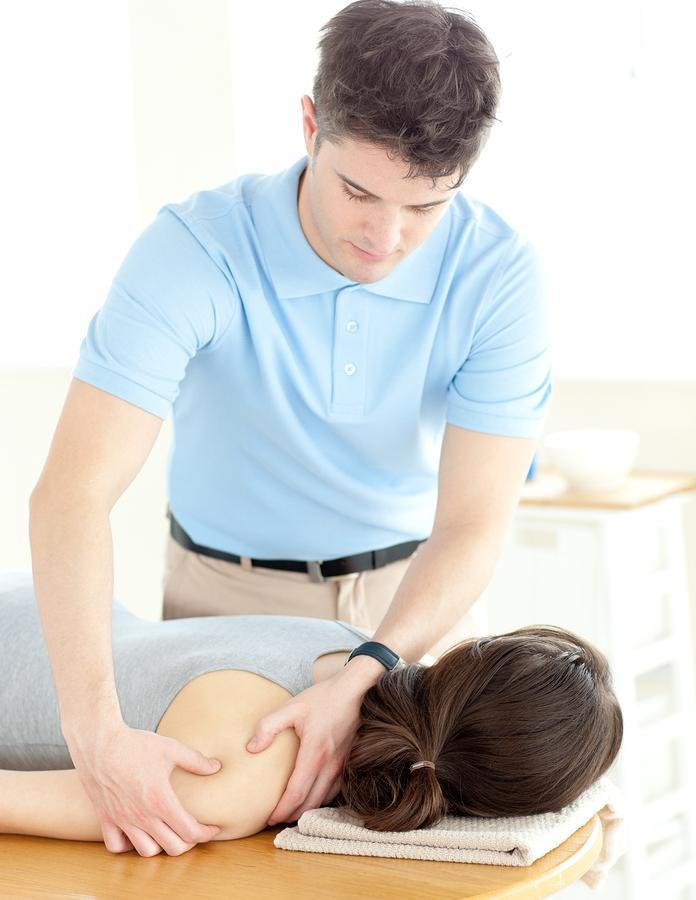 Physical Therapist Massages Shoulder Pain