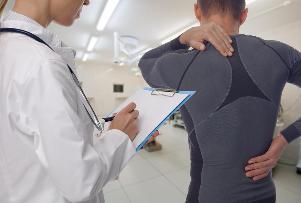 Chiropractor treating athlete for sports injuries