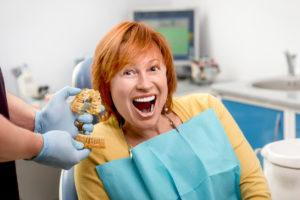 smiling patient in dentist's chair
