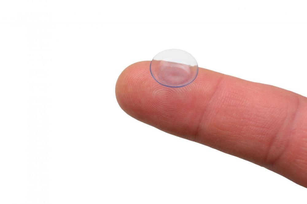 finger on a contact lens from Eye Doctors of Arizona