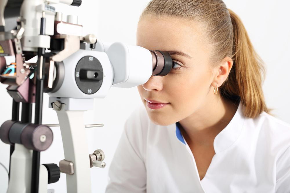 optometrist doing eye exam