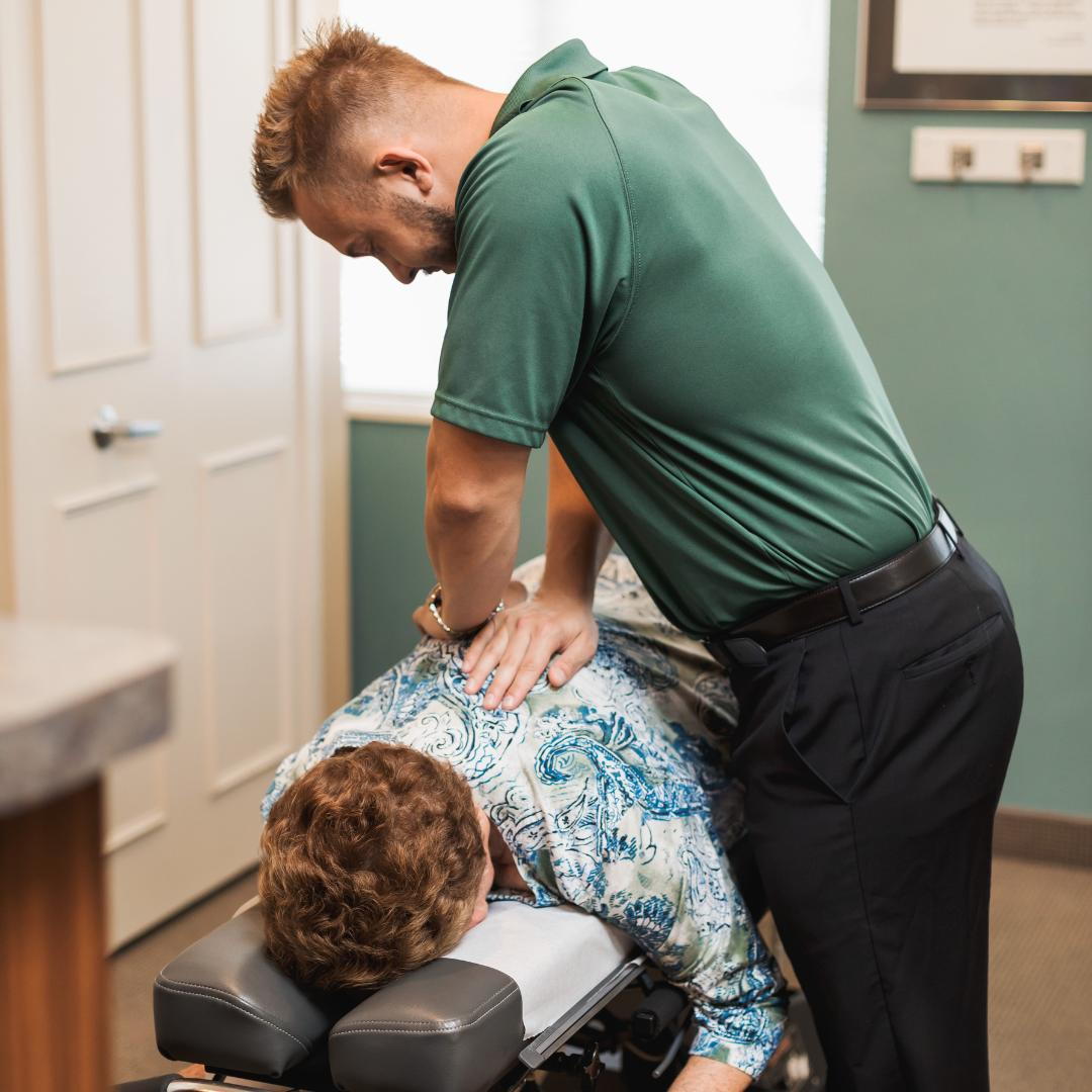 Dr. Nathan Blackwell for Clairpointe Family Chiropractic adjusting a patient.