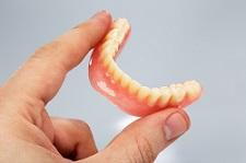 Dentures in Hand