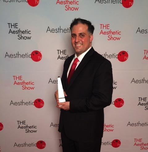 photograph of Dr. Alex on the Red Carpet with the Aesthetic Practice of the Year award