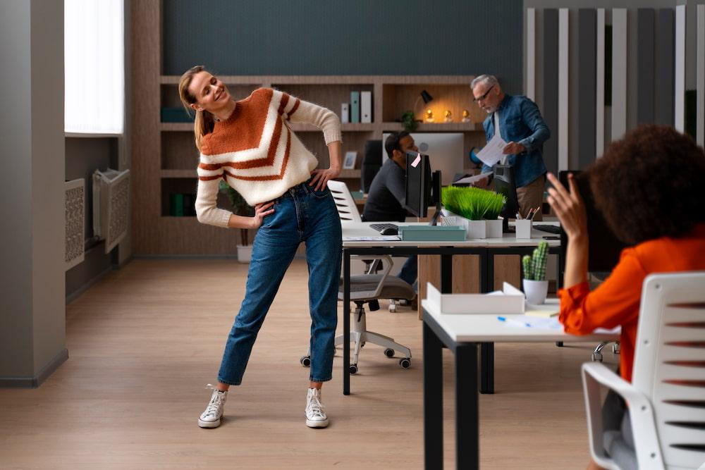 woman doing a standing stretch in between breaks