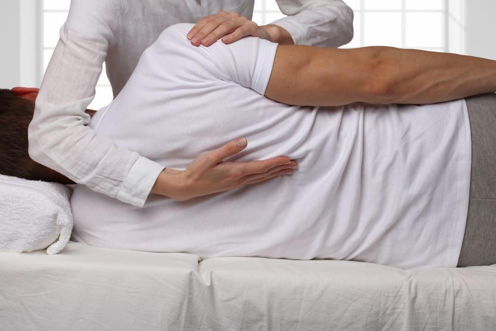 Chiropractor treats a man with herniated disc in kenosha wi