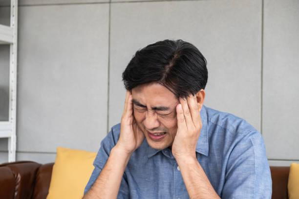 Man suffers from intense pain caused by headache