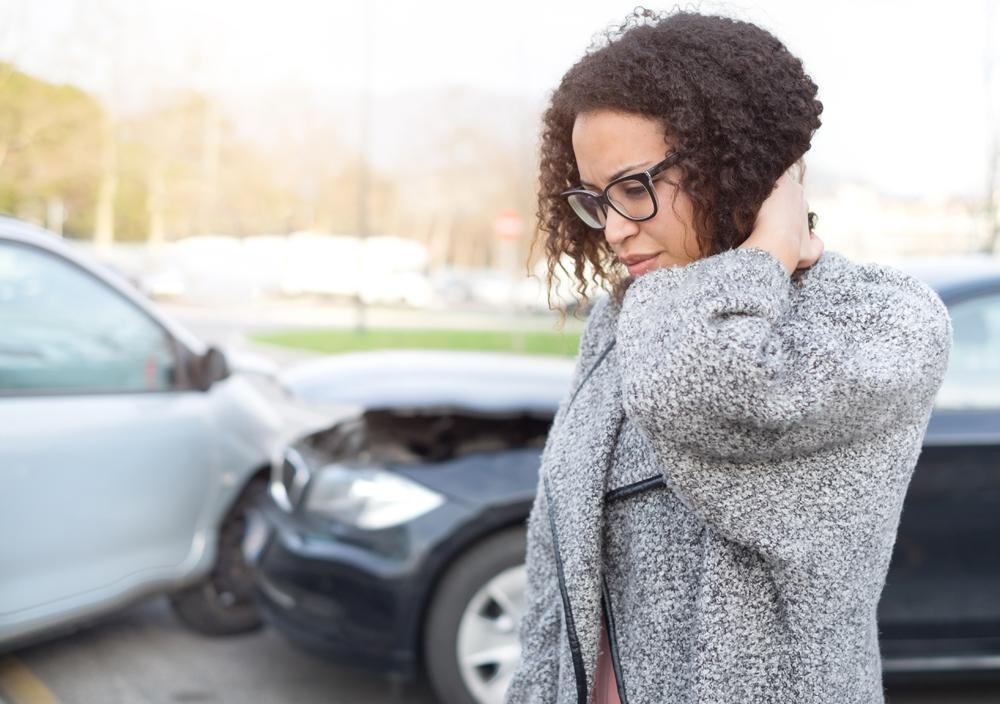 Woman with whiplash after an auto accident.