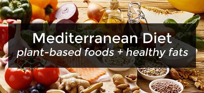 mediterranean diet digestive health benefits with food items in the background