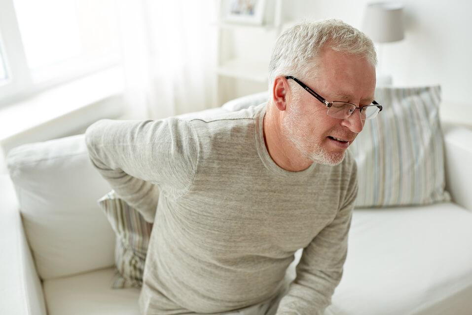 man suffering low back pain